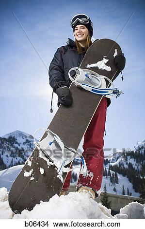 Picture - Female snowboarder. Fotosearch