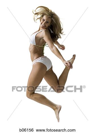 Stock Photograph - Female swimmer jumping. Fotosearch
