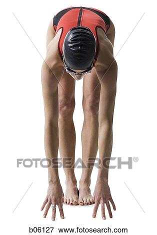 Stock Photo - Female swimmer on her mark. Fotosearch