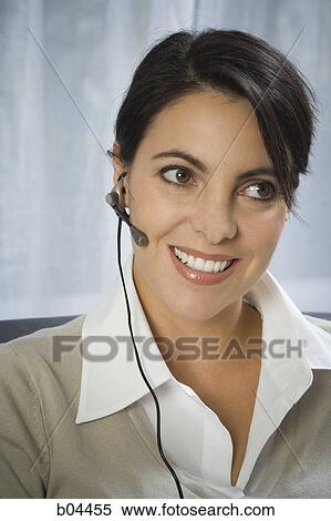 Stock Photography - Female with headset. Fotosearch