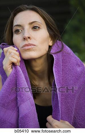 Female with towel outdoors View Large Photo Image Stock Image - Female with towel outdoors. Fotosearch