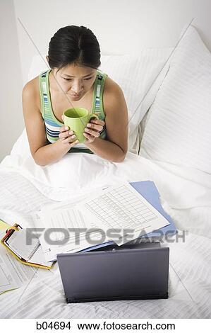 Female working from bed View Large Photo Image Picture - Female working from bed. Fotosearch