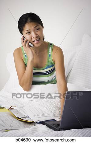 Female working from bed View Large Photo Image Stock Image - Female working from bed. Fotosearch