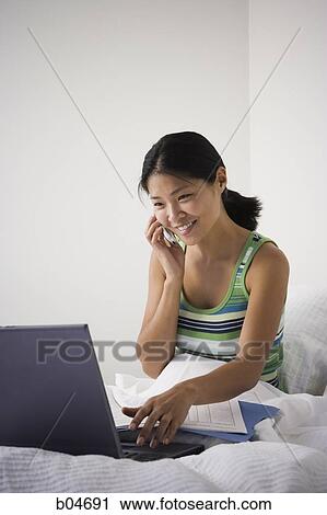 Female working from bed View Large Photo Image Stock Image - Female working from bed. Fotosearch