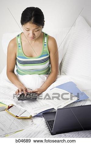 Female working from bed View Large Photo Image Stock Photo - Female working from bed. Fotosearch