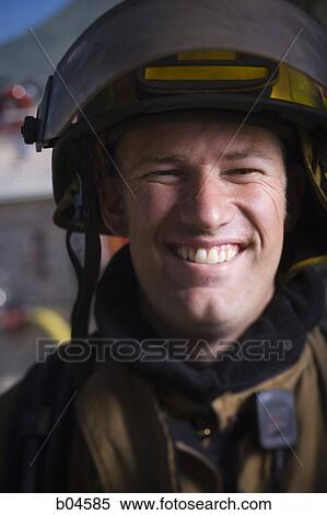 Fire fighter in uniform smiling View Large Photo Image Stock Photography - Fire fighter in uniform smiling. Fotosearch