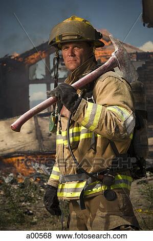 Stock Photo - Fire fighter with axe. Fotosearch