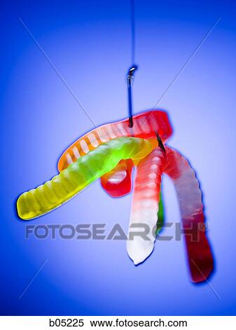 Stock Photography - Fishing hook with gummy worms. Fotosearch