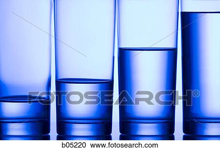 Four glasses of water with varying levels View Large Photo Image Stock Image - Four glasses of water with varying levels. Fotosearch