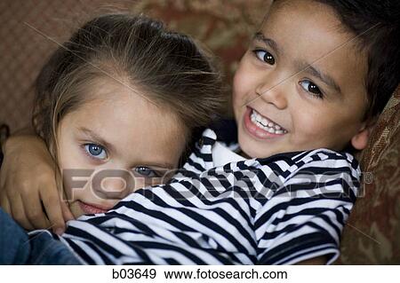 Girl and boy smiling View Large Photo Image Stock Photo - Girl and boy smiling. Fotosearch