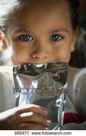Girl drinking from a juice pack View Large Photo Image Stock Image - Girl drinking from a juice pack. Fotosearch