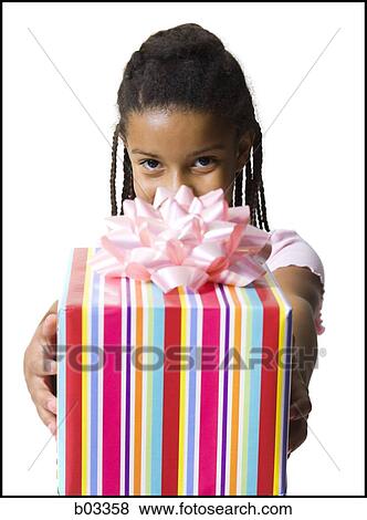 Girl holding birthday present View Large Photo Image Stock Photo - Girl holding birthday present. Fotosearch