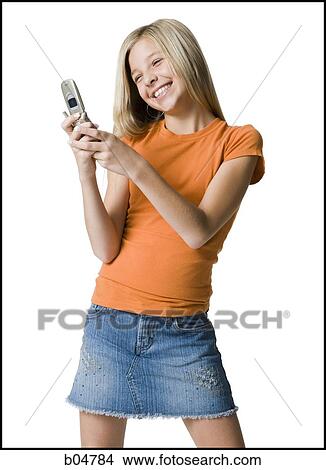 Girl holding cell phone smiling View Large Photo Image Picture - Girl holding cell phone smiling. Fotosearch