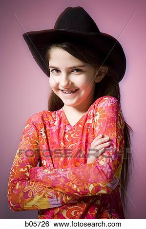 Girl in a cowboy hat View Large Photo Image Stock Photograph - Girl in a cowboy hat. Fotosearch
