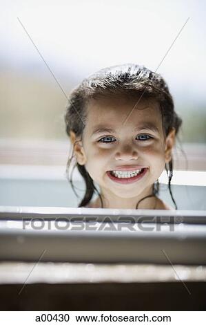 Girl in bathtub smiling View Large Photo Image Stock Image - Girl in bathtub smiling. Fotosearch