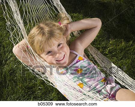 Girl in swimsuit laying in hammock View Large Photo Image Stock Photo - Girl in swimsuit laying in hammock. Fotosearch