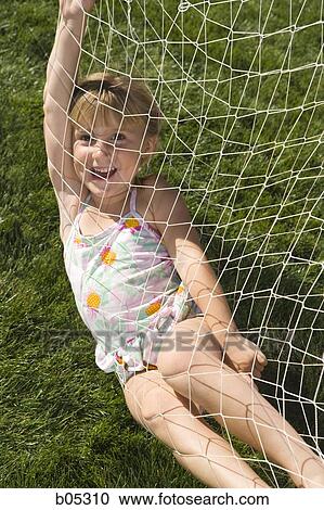 Girl in swimsuit playing in hammock View Large Photo Image Stock Image - Girl in swimsuit playing in hammock. Fotosearch