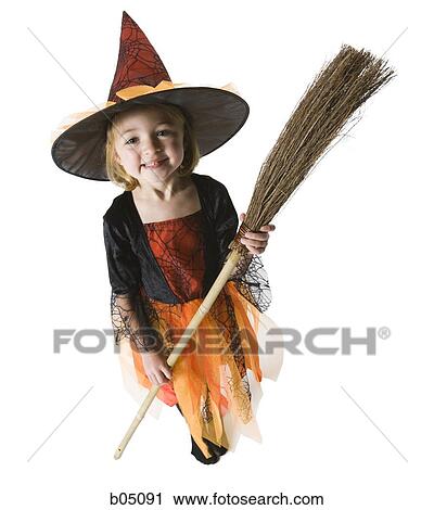 Girl in witch costume with broom View Large Photo Image Stock Image - Girl in witch costume with broom. Fotosearch