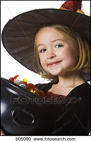 Girl in witch costume with cauldron View Large Photo Image Stock Image - Girl in witch costume with cauldron. Fotosearch