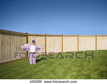 Girl in yard in halloween costume View Large Photo Image Stock Photo - Girl in yard in halloween costume. Fotosearch