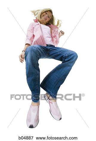 Girl leaping looking up View Large Photo Image Stock Photo - Girl leaping looking up. Fotosearch