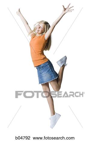 Stock Image - Girl leaping with arms up. Fotosearch