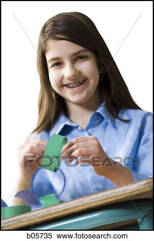 Girl making paper rings View Large Photo Image Stock Photography - Girl making paper rings. Fotosearch