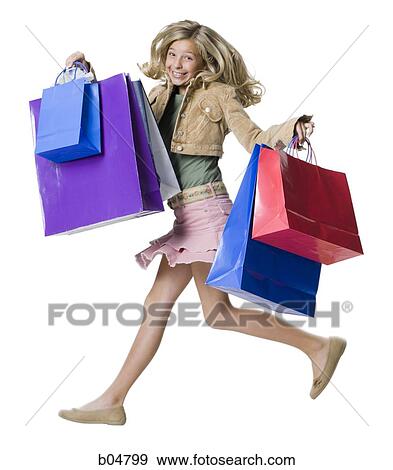 Girl running with shopping bags View Large Photo Image Stock Photo - Girl running with shopping bags. Fotosearch