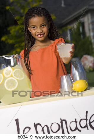 Girl selling lemonade View Large Photo Image Stock Photo - Girl selling lemonade. Fotosearch