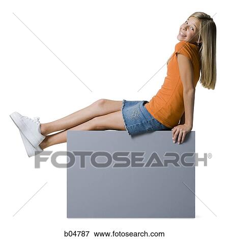 Stock Photo - Girl sitting on blank sign. Fotosearch