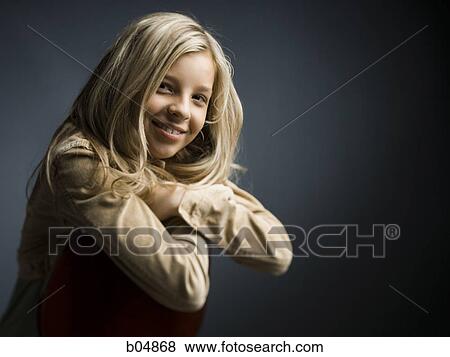 Girl sitting on chair with arms crossed View Large Photo Image Stock Photo - Girl sitting on chair with arms crossed. Fotosearch
