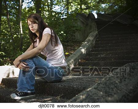 Girl sitting on stairs View Large Photo Image Stock Photo - Girl sitting on stairs. Fotosearch