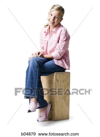 Girl sitting on wooden crate View Large Photo Image Stock Photo - Girl sitting on wooden crate. Fotosearch