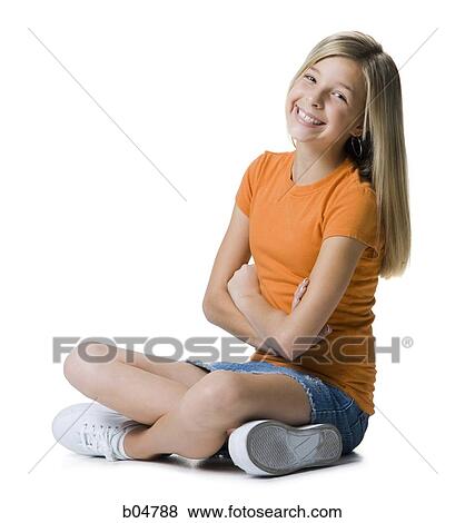 Stock Photo - Girl sitting with arms and legs crossed. Fotosearch