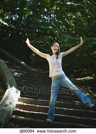 Girl standing on stairs View Large Photo Image Picture - Girl standing on stairs. Fotosearch