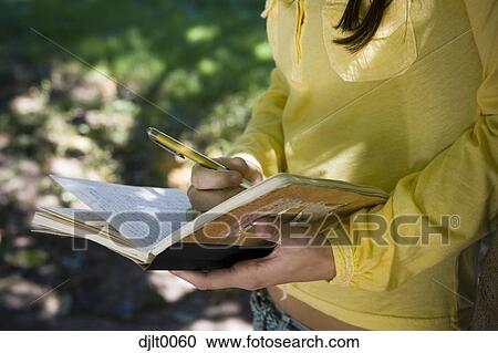 Girl studying outdoors View Large Photo Image Stock Image - Girl studying outdoors. Fotosearch