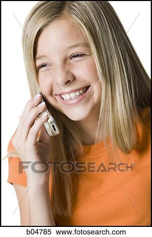 Girl talking on cell phone smiling View Large Photo Image Stock Photography - Girl talking on cell phone smiling. Fotosearch