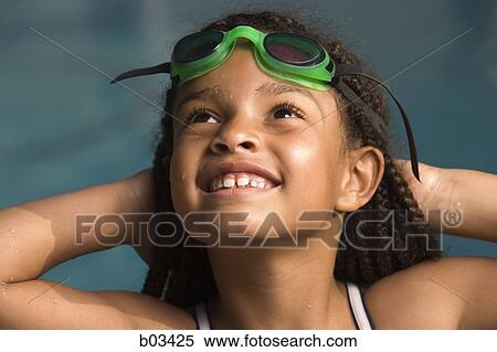 Girl wearing swimming goggles View Large Photo Image Stock Photography - Girl wearing swimming goggles. Fotosearch