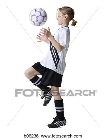 Stock Photograph - Girl with a soccer ball. Fotosearch