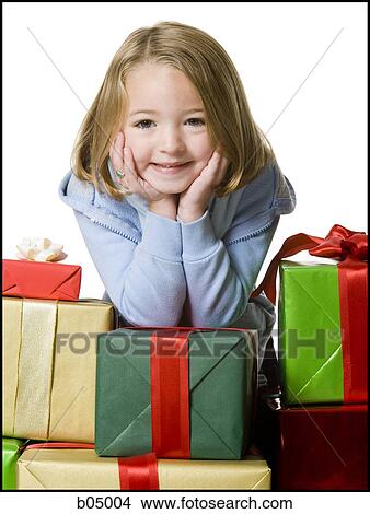 Girl with Christmas gifts View Large Photo Image Picture - Girl with Christmas gifts. Fotosearch