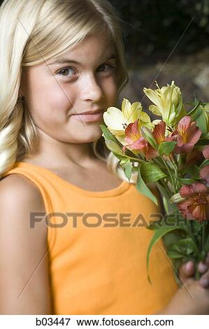 Stock Photo - Girl with flowers. Fotosearch