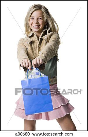 Girl with gift bag View Large Photo Image Stock Image - Girl with gift bag. Fotosearch