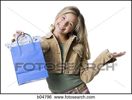 Girl with gift bag View Large Photo Image Stock Photograph - Girl with gift bag. Fotosearch