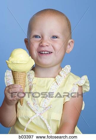 Girl with ice cream cone View Large Photo Image Stock Photo - Girl with ice cream cone. Fotosearch