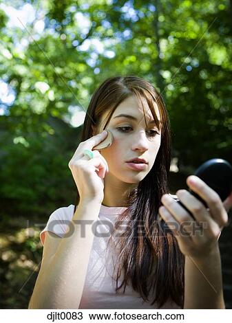 Girl with makeup mirror View Large Photo Image Stock Image - Girl with makeup mirror. Fotosearch