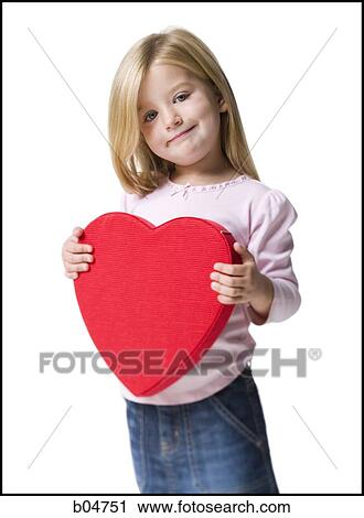 Stock Image - Girl with red heart. Fotosearch