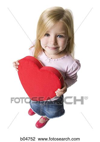 Girl with red heart View Large Photo Image Stock Image - Girl with red heart. Fotosearch