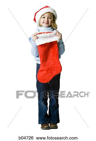 Girl with santa hat and Christmas stocking View Large Photo Image Stock Photograph - Girl with santa hat and Christmas stocking. Fotosearch