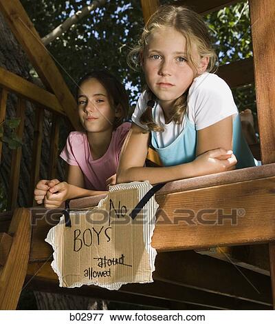 Girlfriends in a tree house View Large Photo Image Stock Photo - Girlfriends in a tree house. Fotosearch