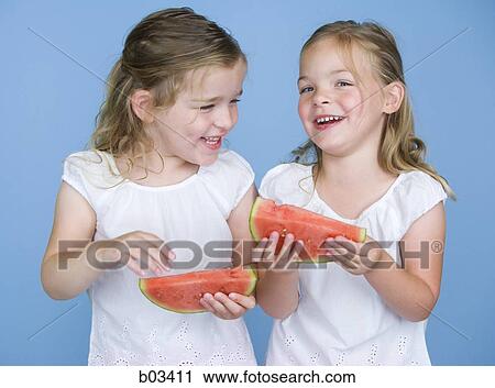 Girls holding watermelon View Large Photo Image Stock Image - Girls holding watermelon. Fotosearch